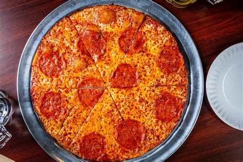 Colony pizza - Jan 17, 2019 · Colony Grill and Riko's are know in town as rival pizza spots both offering the signature hot oil pie. But which one's better? Barstool Sports, the semi-raunchy news site geared toward millennial ... 